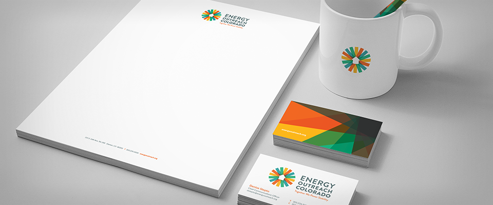 Energy Outreach Colorado branded stationery, mug, and business cards