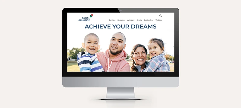 Desktop monitor showing the Canal Alliance website homepage with the headline