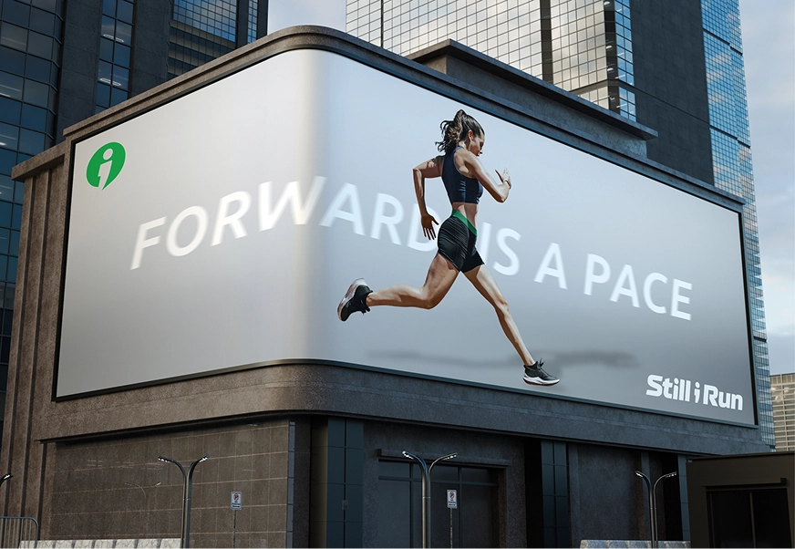 A city billboard mockup showing a woman running with the text 'Forward Is a Pace' and the Still I Run logo