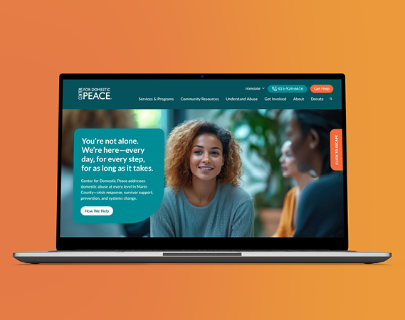 Laptop mockup on an orange background showing the Center for Domestic Peace website with the message 'You're not alone. We're here, every day, for every step, for as long as it takes'